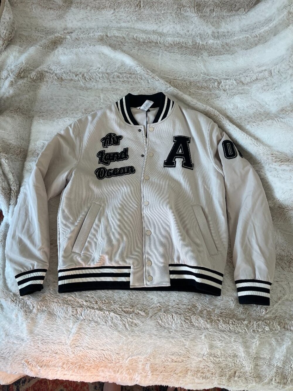 Authentic Alo Yoga unisex G.O.A.T. Varsity Letterman-style jacket in Bone Small